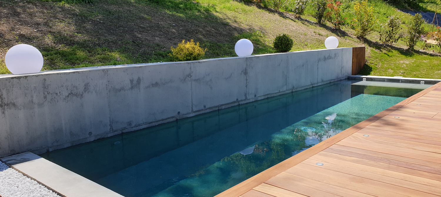 piscine beton brut pernollet paysage